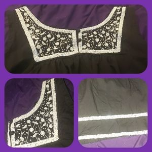 Black top with beaded accents